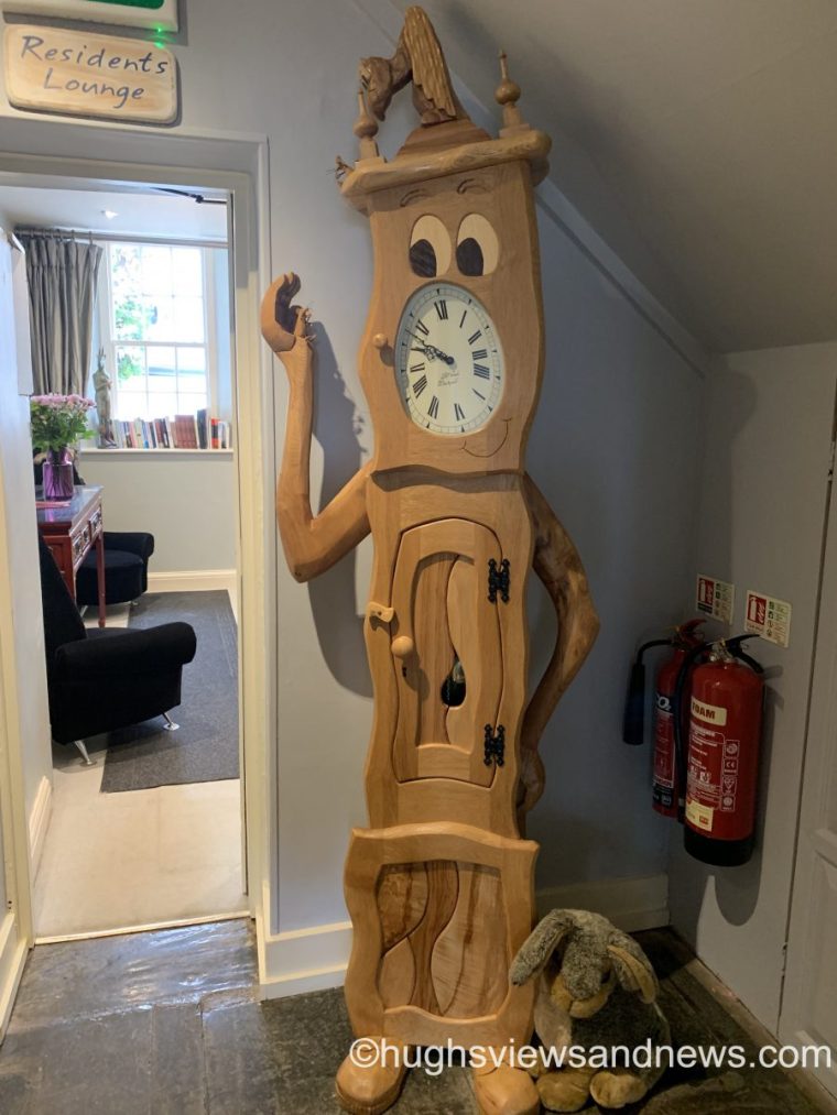 A photo of an unusual wooden clock from Alice in Wonderland