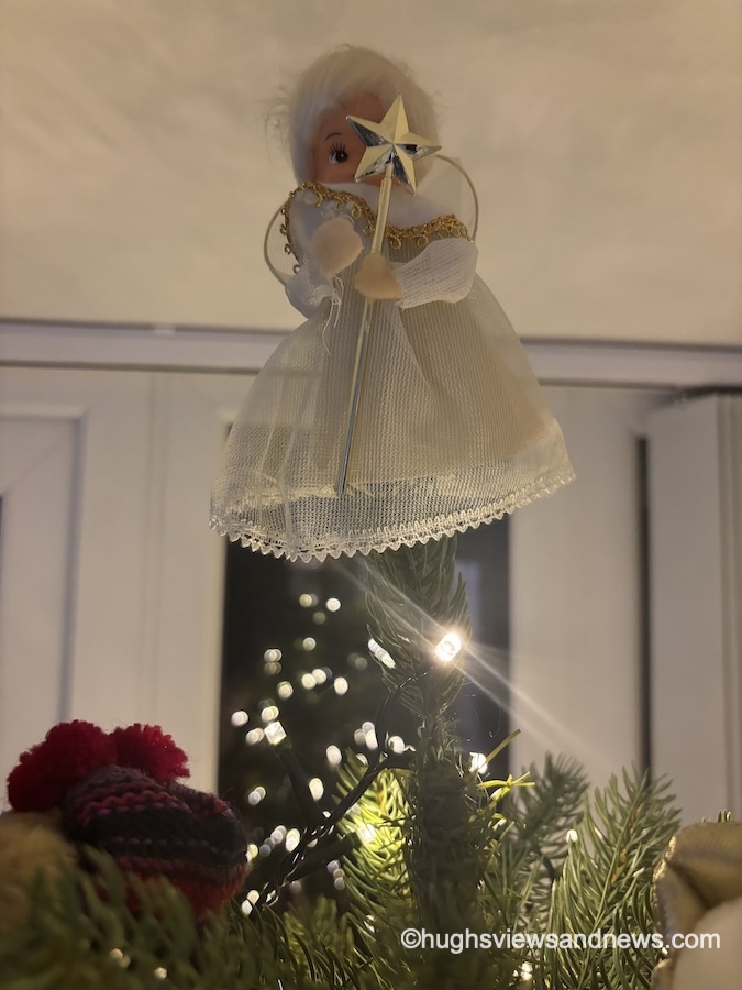 Photo of a Christmas angel on top of a Christmas tree